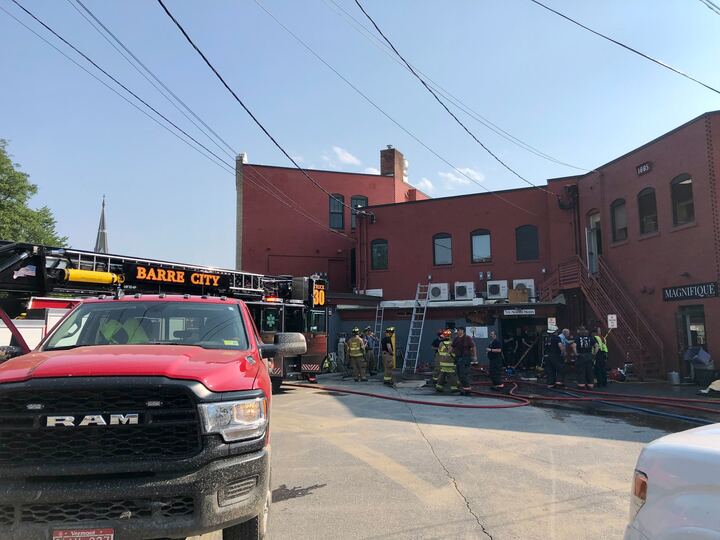 a fire truck is parked in front of a building.