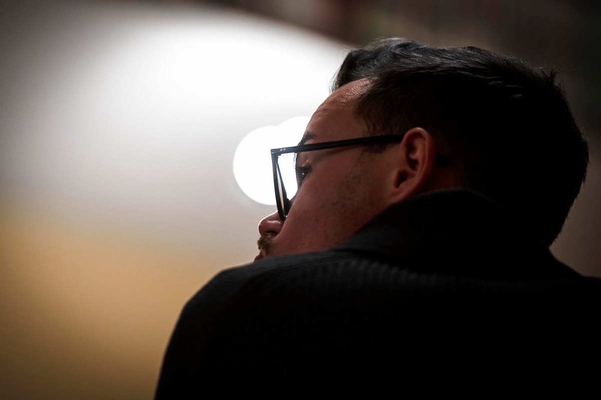 A man listens during a meeting