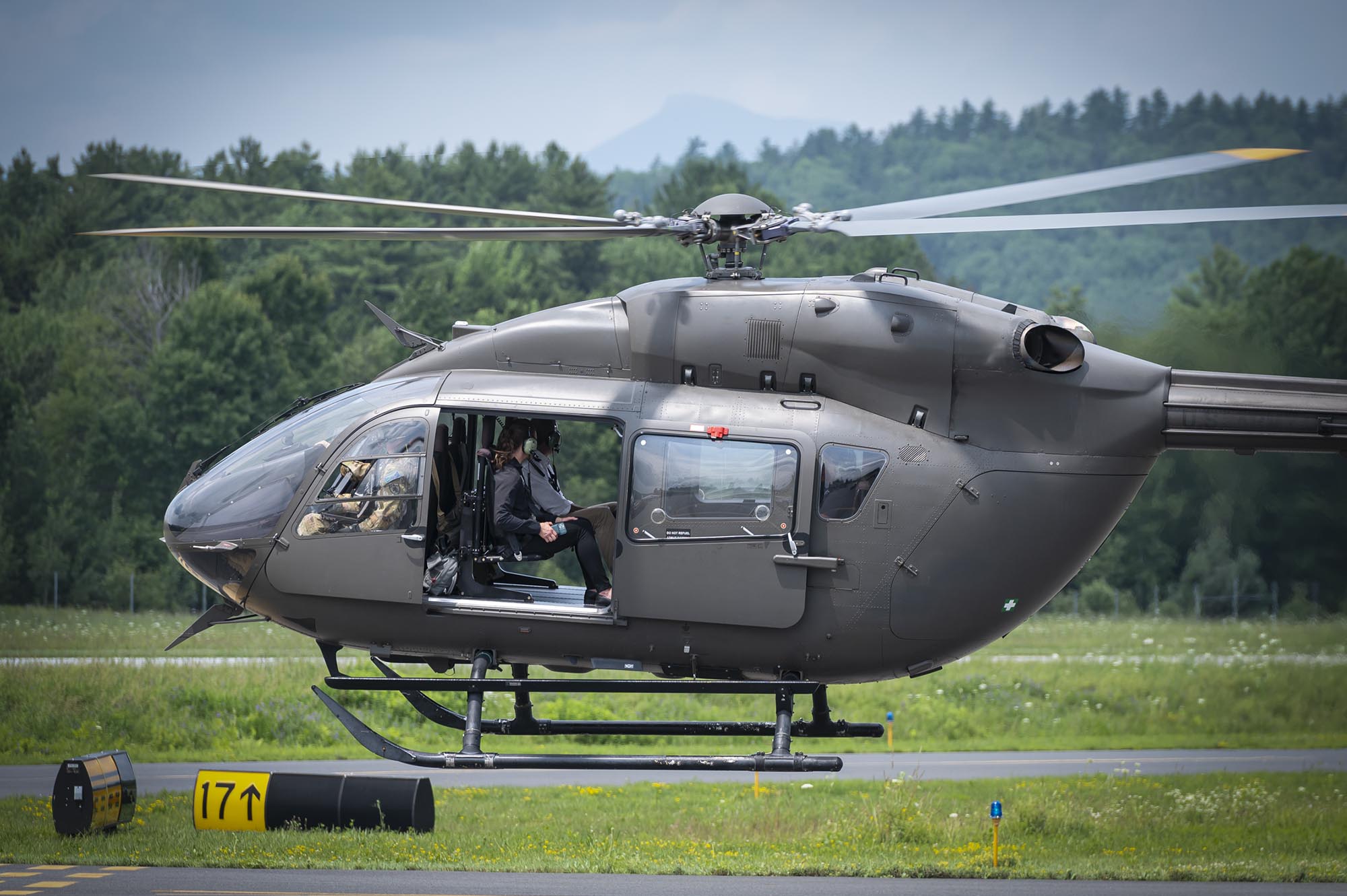 a helicopter is parked on a runway.