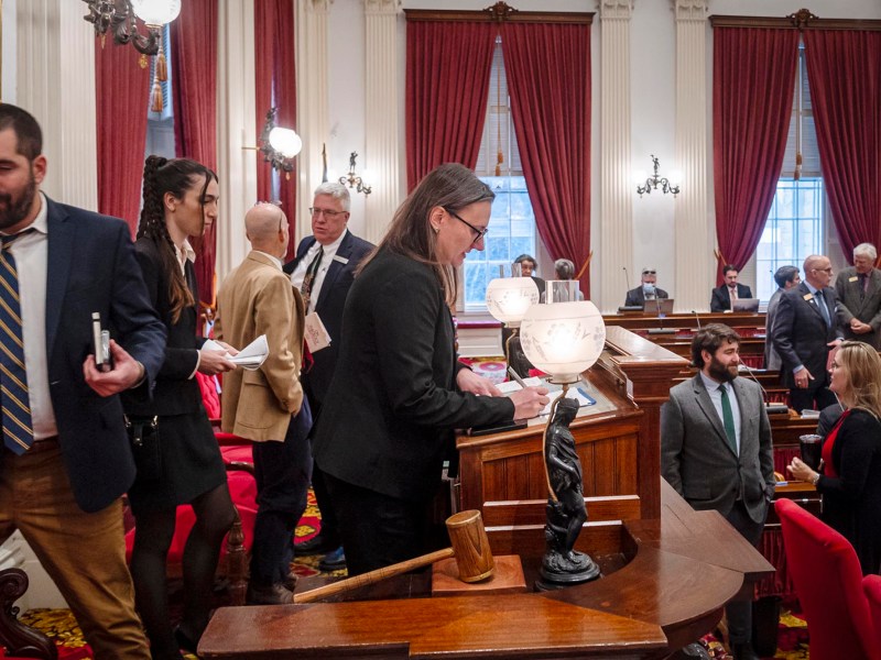 A group of people standing in a room.