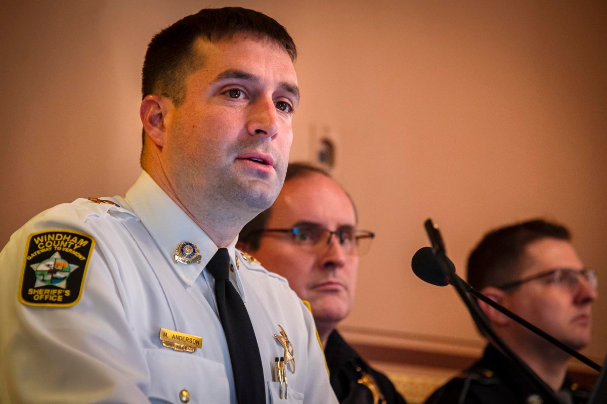 A police officer is speaking at a press conference.