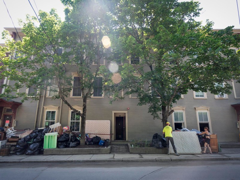 a group of people standing in front of a building.