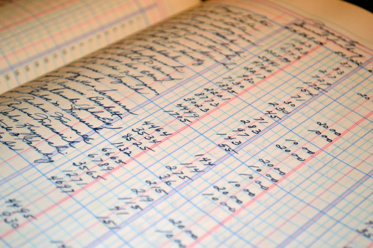a close up of numbers written in a ledger.