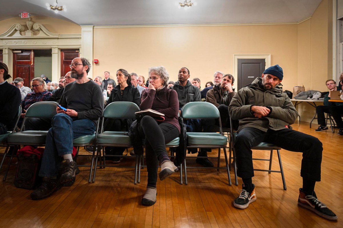 A group of people sitting in chairs.