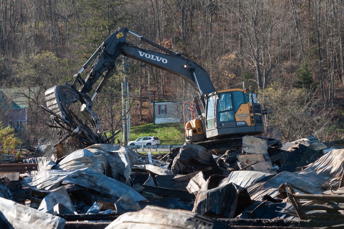 An excavator moves debris.