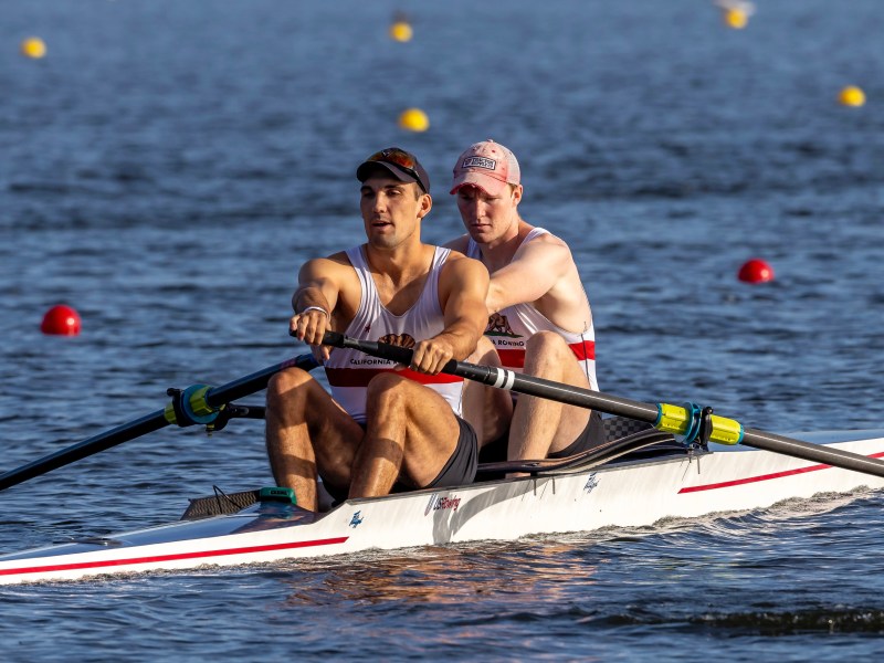 Two men rowing.