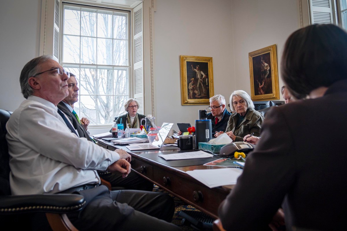 A group of people sitting around a table.