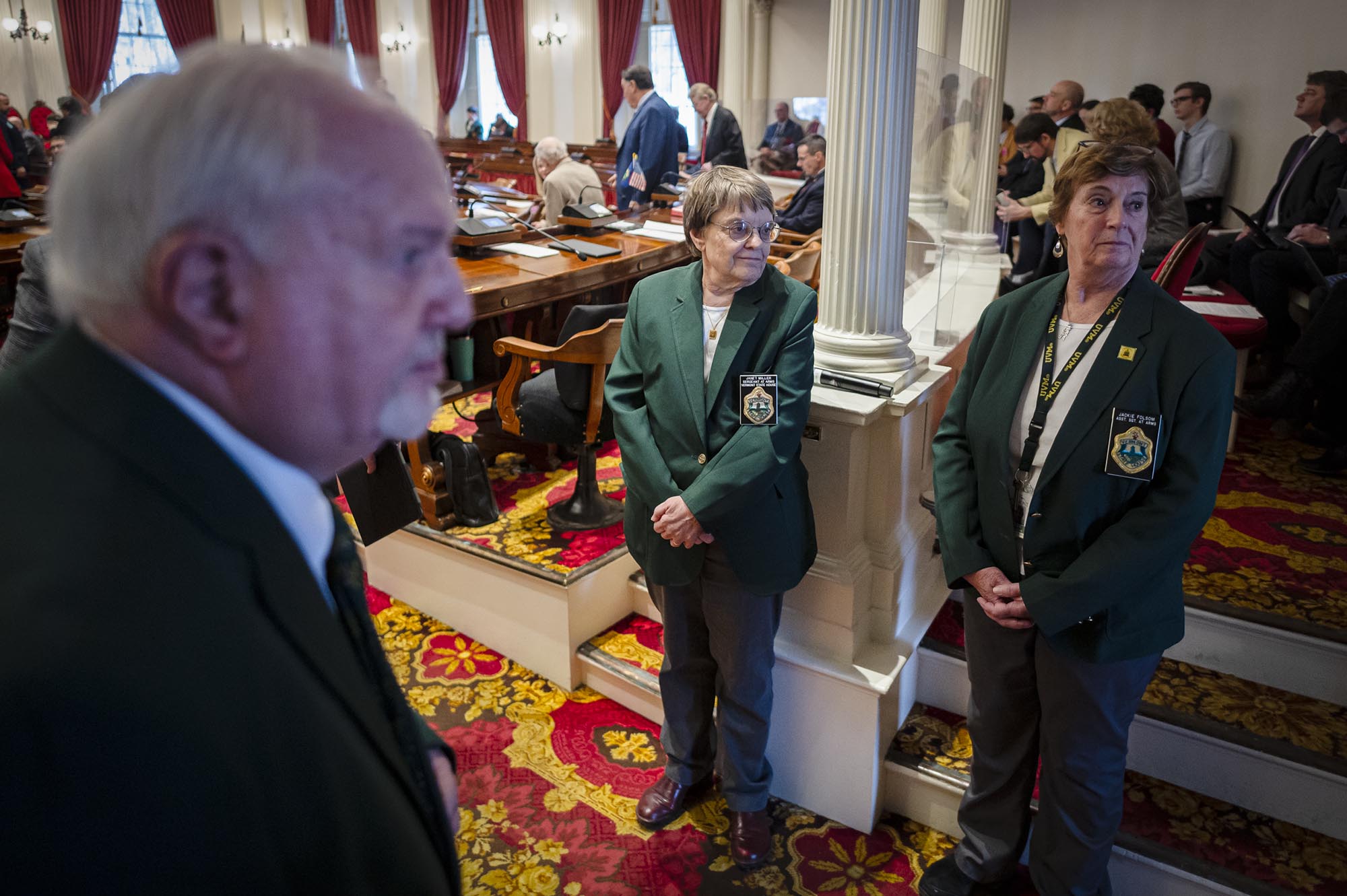 A group of people standing in a room.
