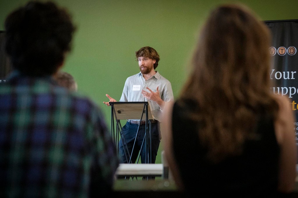 A man giving a presentation to a group of people.