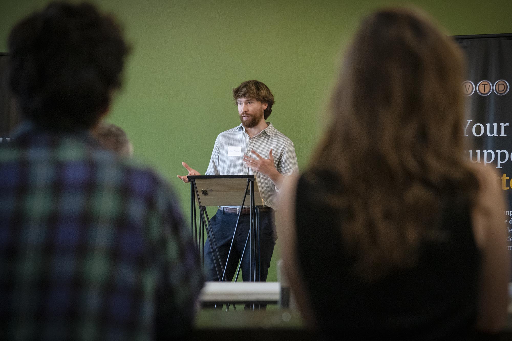 A man giving a presentation to a group of people.