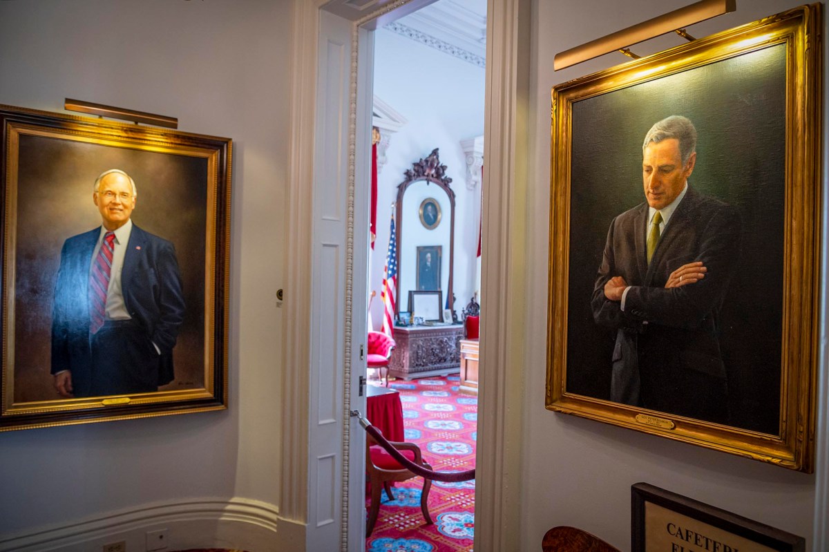 Two portraits of former governors Jim Douglas and Peter Shumlin hang in the Statehouse in Montpelier