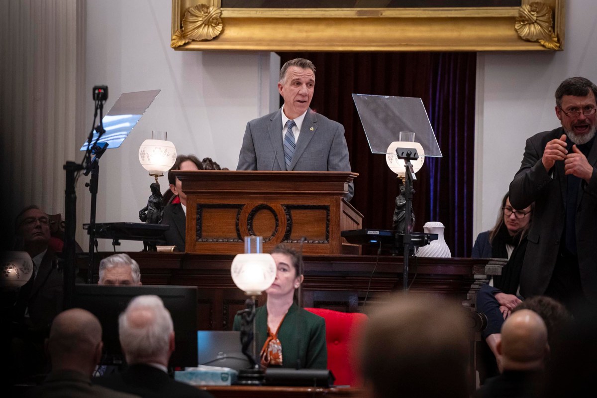 A man standing at a podium in front of a group of people.