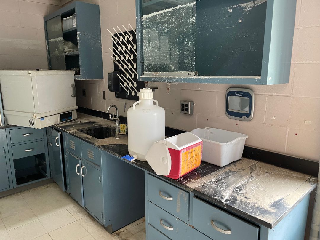 a kitchen with blue cabinets and a sink.