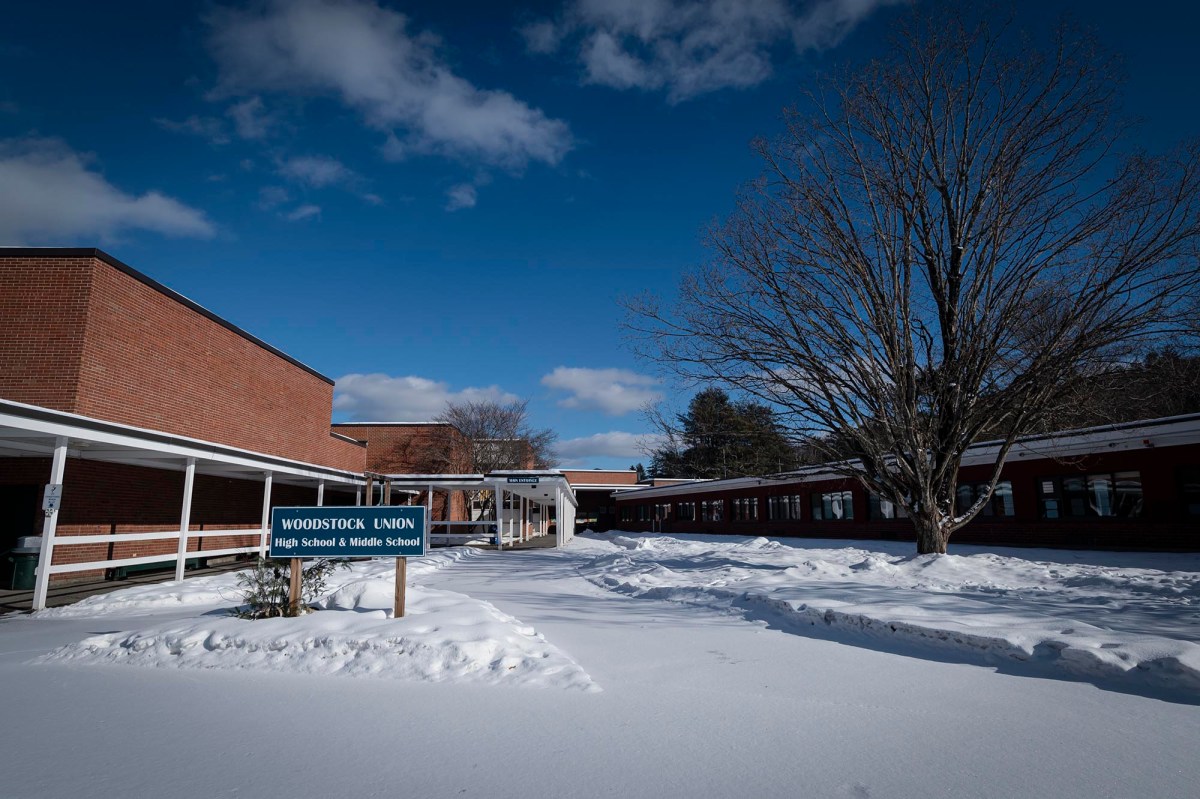 A school building is covered in snow.