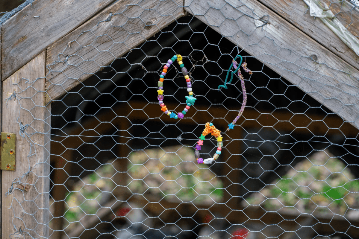 bracelets on a wire fence