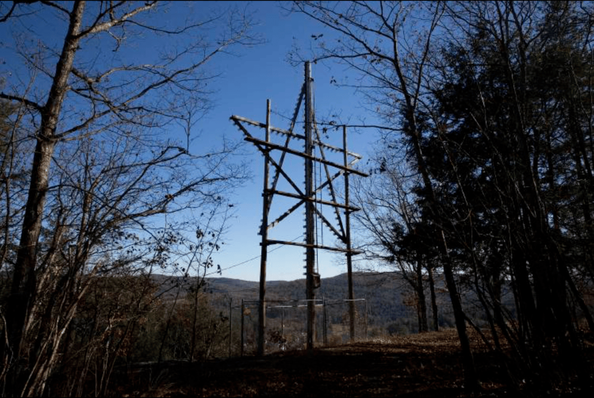 a wooden star on a hill