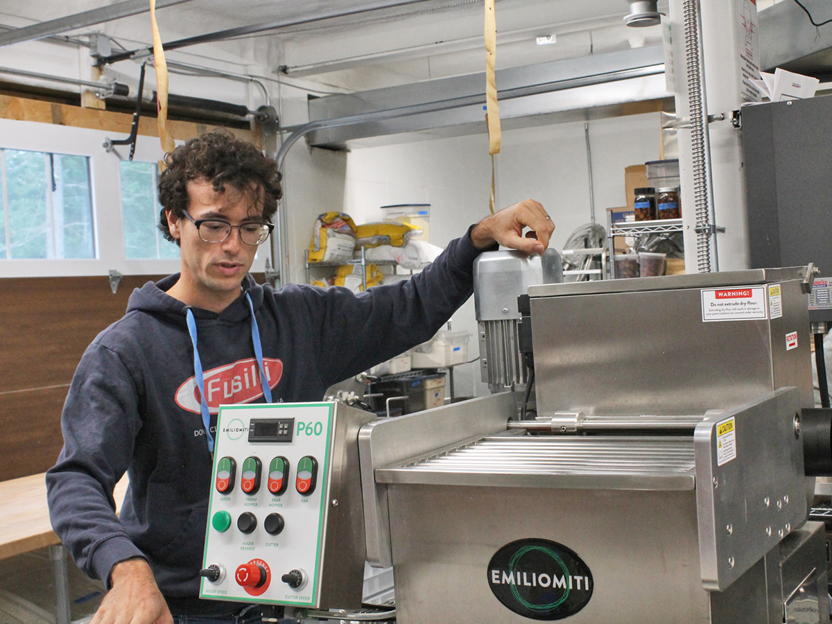 A man working on a machine in a factory.
