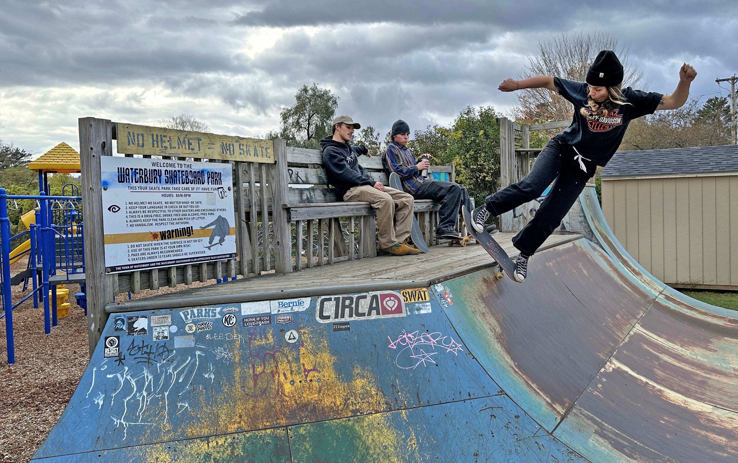 People ride skateboards at a park.