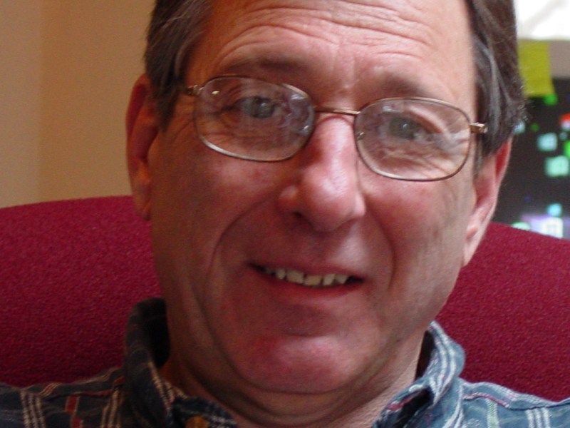 A man smiling for a photo.