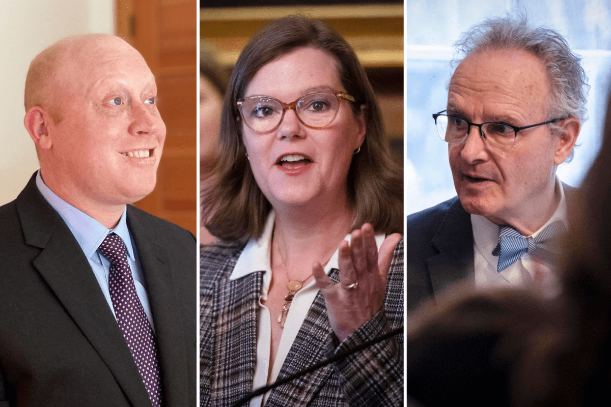 Three adults dressed formally are engaged in separate discussions. The first person on the left is smiling. The middle person is gesturing with their hand. The person on the right is speaking animatedly.