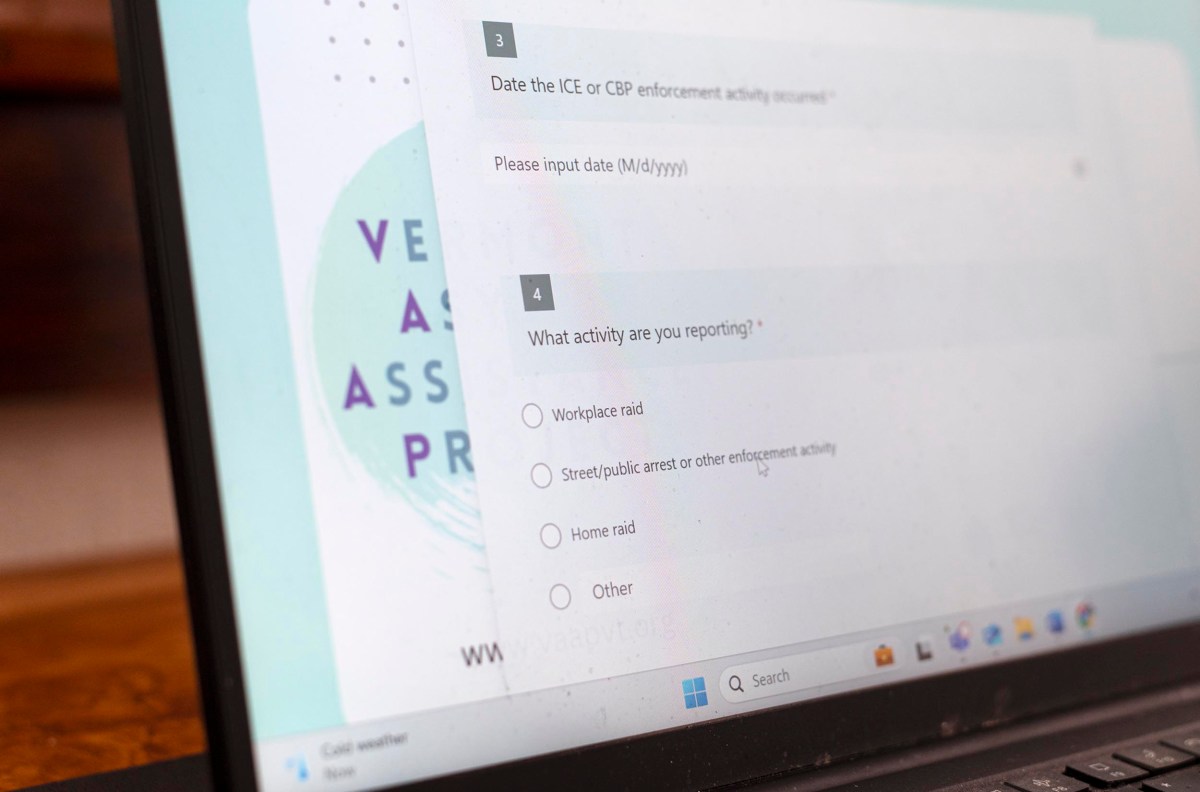 A laptop screen displays a form with questions about reporting activities, including options for "Workplace raid" and "Street/public arrest or other enforcement activity.