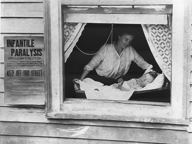 A woman tends to a child lying in a crib by an open window; a sign outside warns of "Infantile Paralysis (Poliomyelitis)" and instructs people to keep off the street.