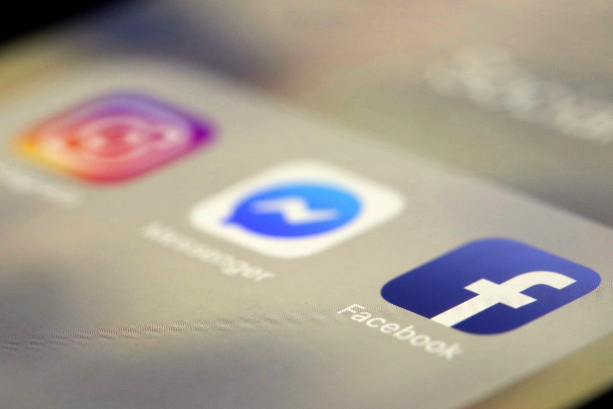 Close-up of a smartphone screen displaying the Instagram, Messenger, and Facebook app icons.