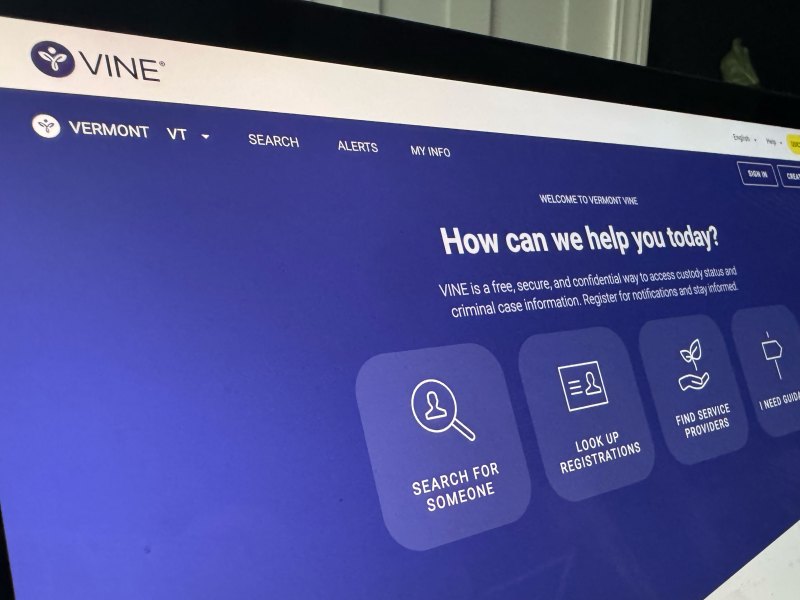 Computer screen displaying the VINE Vermont website homepage with options to search for someone, look up registrations, find service providers, or get guidance.