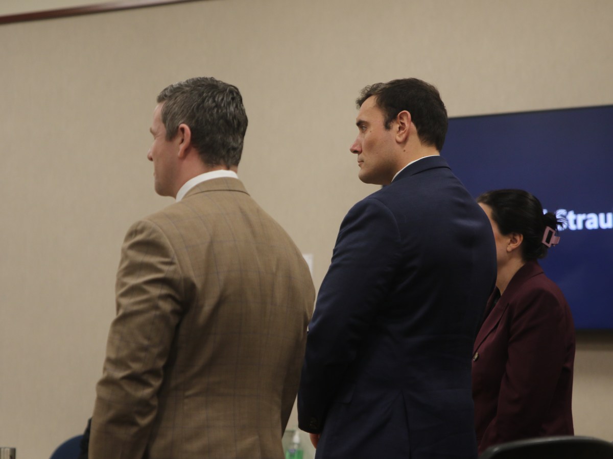 Burlington police officer denies charges he fired recklessly into vehicle with two minors in it