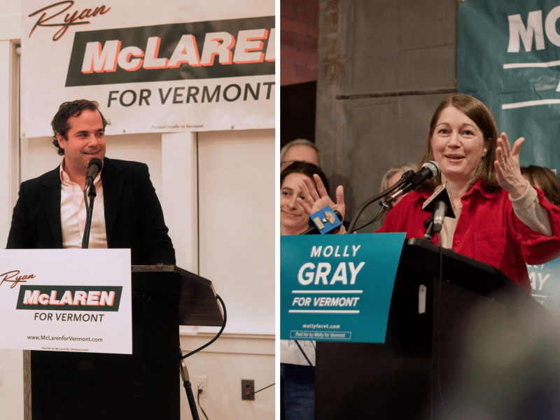 A man and a woman each stand at separate podiums with campaign signs; the man’s sign reads "Ryan McLaren for Vermont," and the woman’s reads "Molly Gray for Vermont.