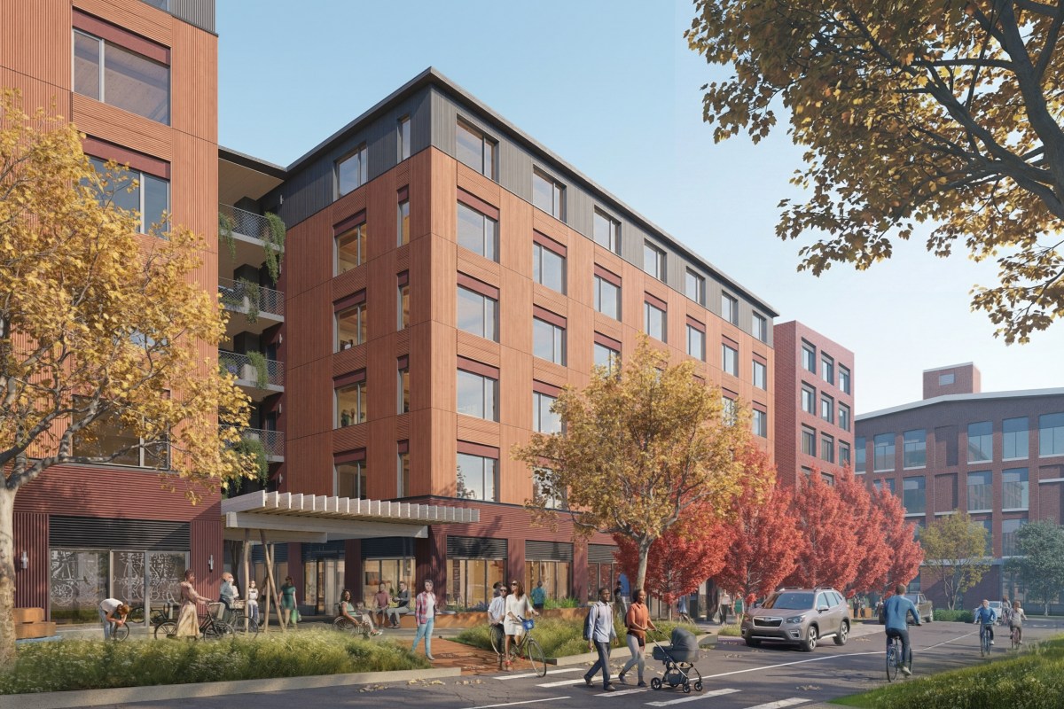 A rendering of a modern mid-rise apartment building with large windows, surrounded by trees with autumn foliage and people walking, biking, and pushing strollers on the sidewalk.