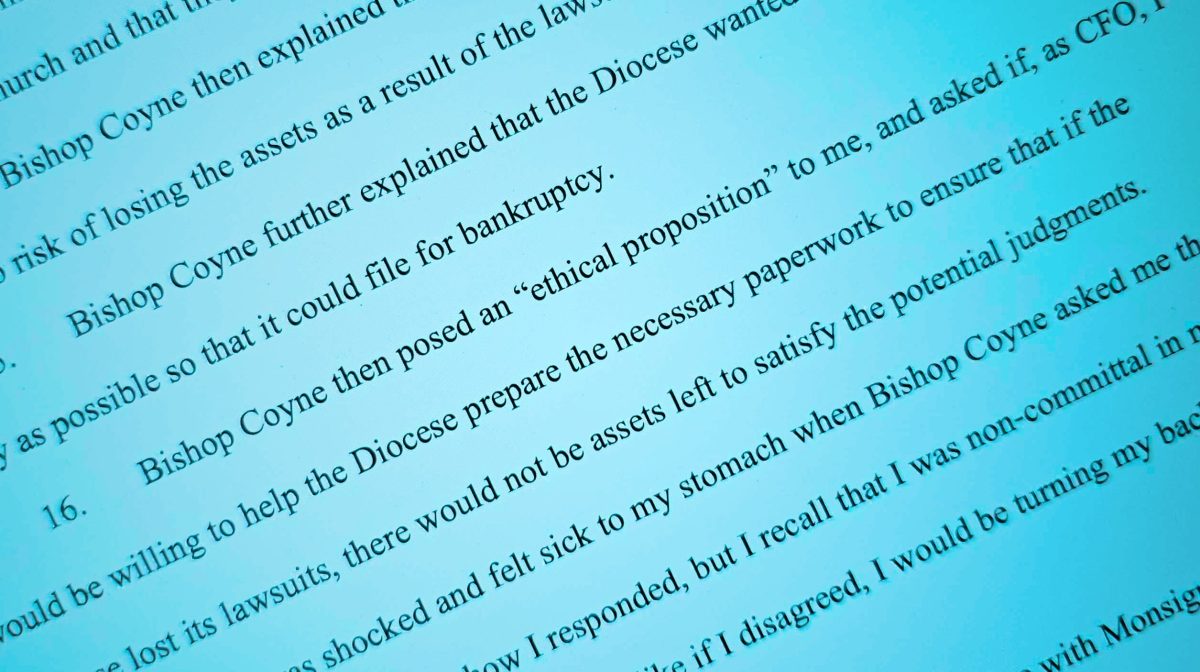 A close-up of a printed document with highlighted text discussing bankruptcy and an "ethical proposition" posed by Bishop Coyne.