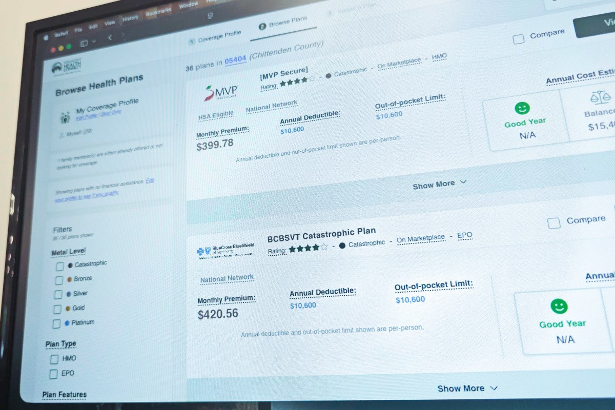 A computer screen displays a health insurance marketplace showing plan options, monthly premiums, deductibles, and filters for selecting coverage.